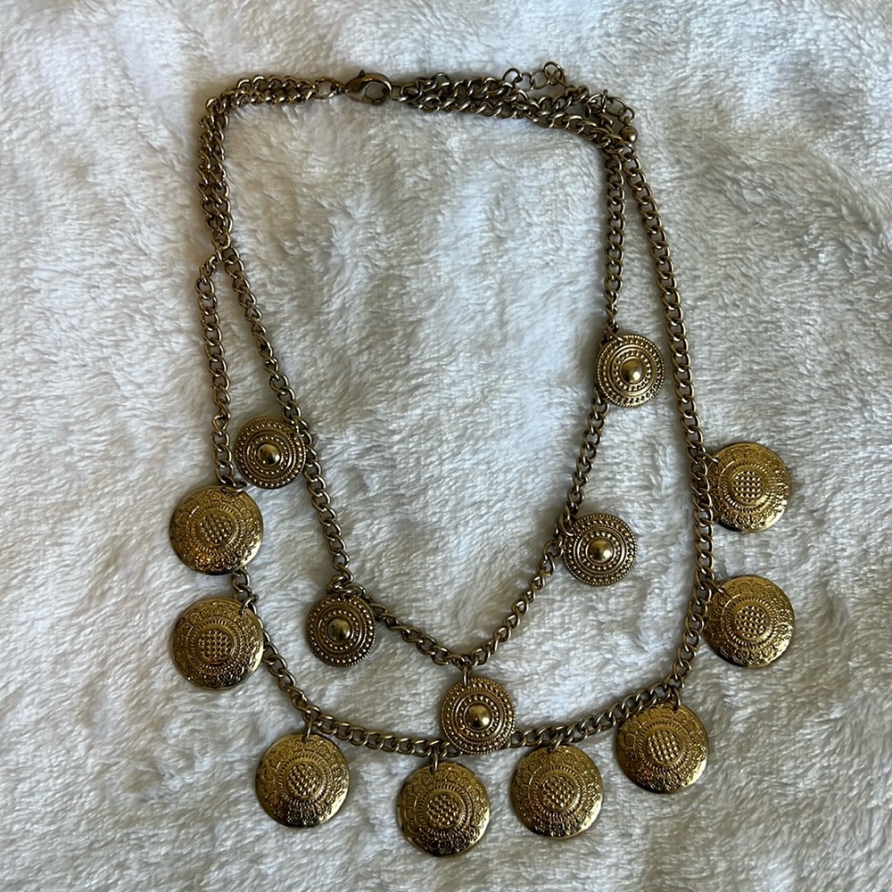Gold necklace with coin like charms